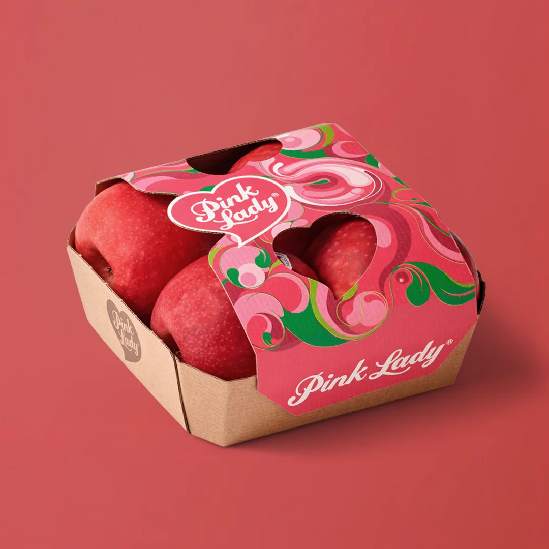 Diseño de packaging para manzanas Pink Lady, ilustración y sistema visual por Bassali.